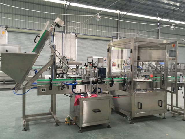vacuum capping machine integrated with lifter.jpg