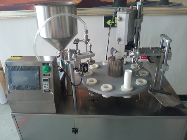 close shot of tubes filling sealing machines.jpg