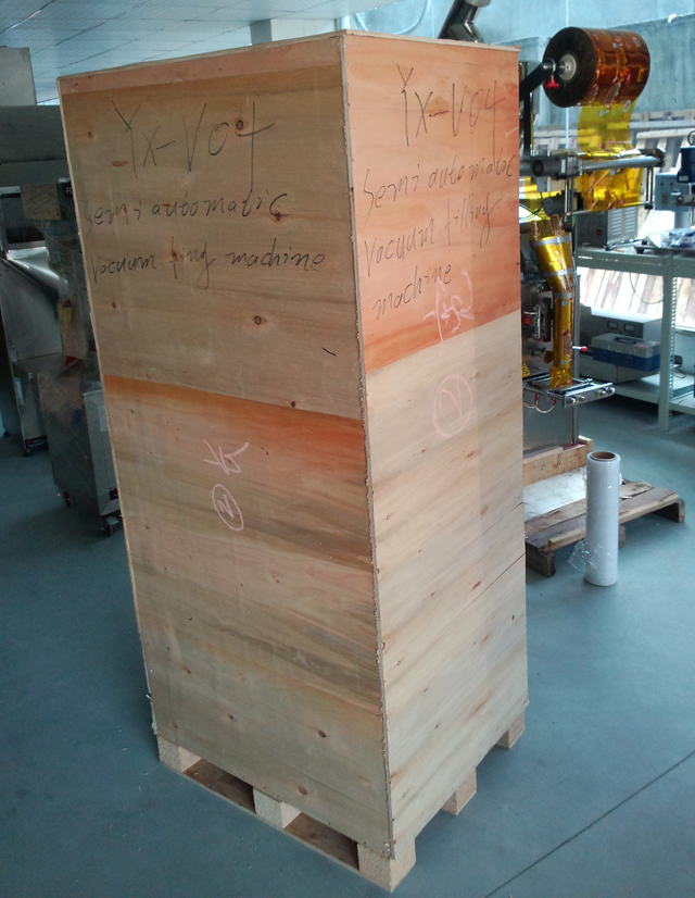 filling machine in wooden case.jpg